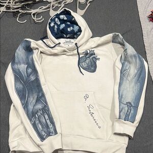 Blue and White Sweatshirt with Unique Graphic Design